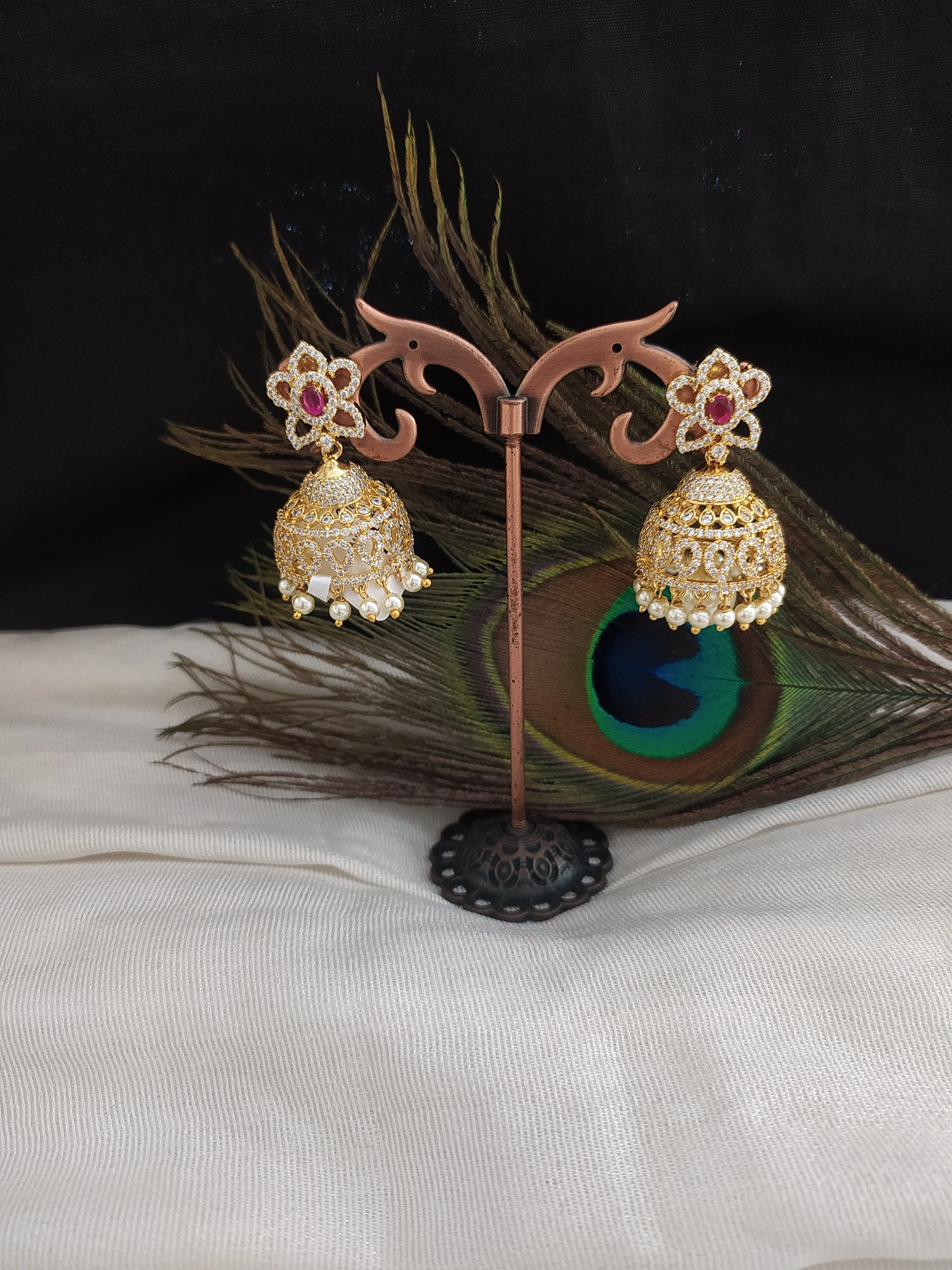 Alluring Gold Plated Jhumka With Zircon Stones With Pearl Dangling