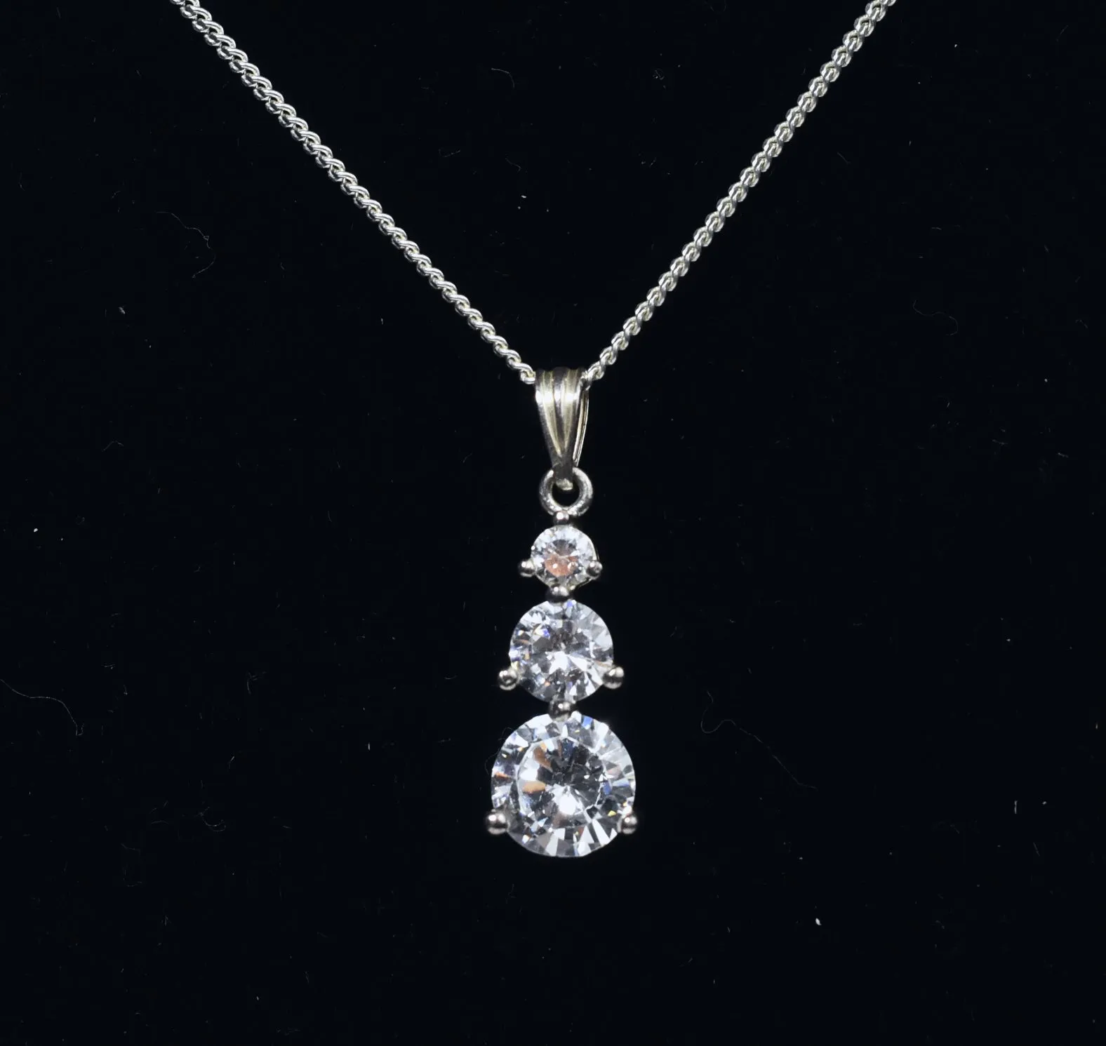 Avon - Sterling Silver Graduated Cubic Zirconia Drop Pendant on Sterling Silver Chain Necklace - 16"