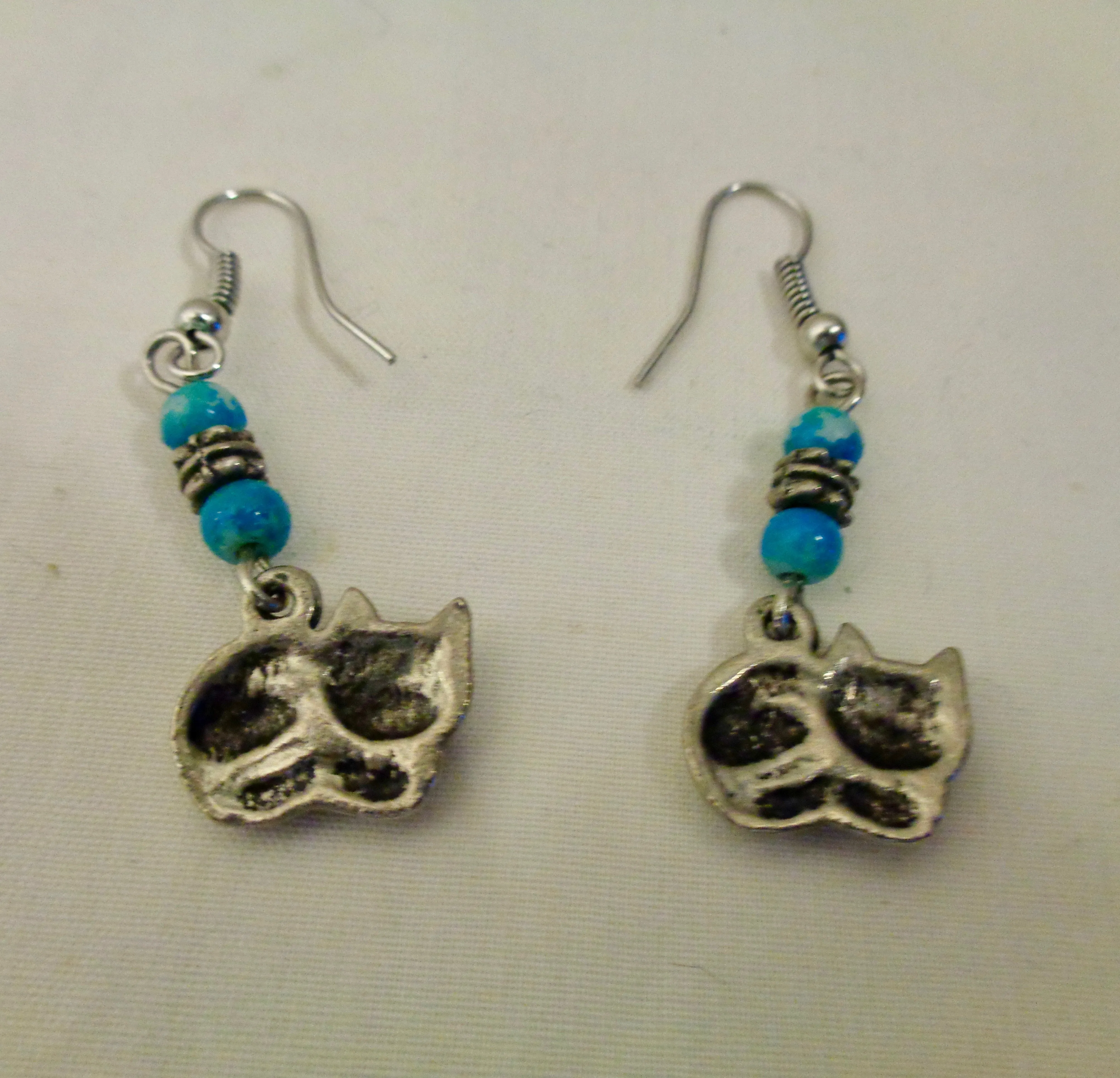 Silver Coloured Metal Cat Dangle And Drop Earrings With Blue Coloured Beads