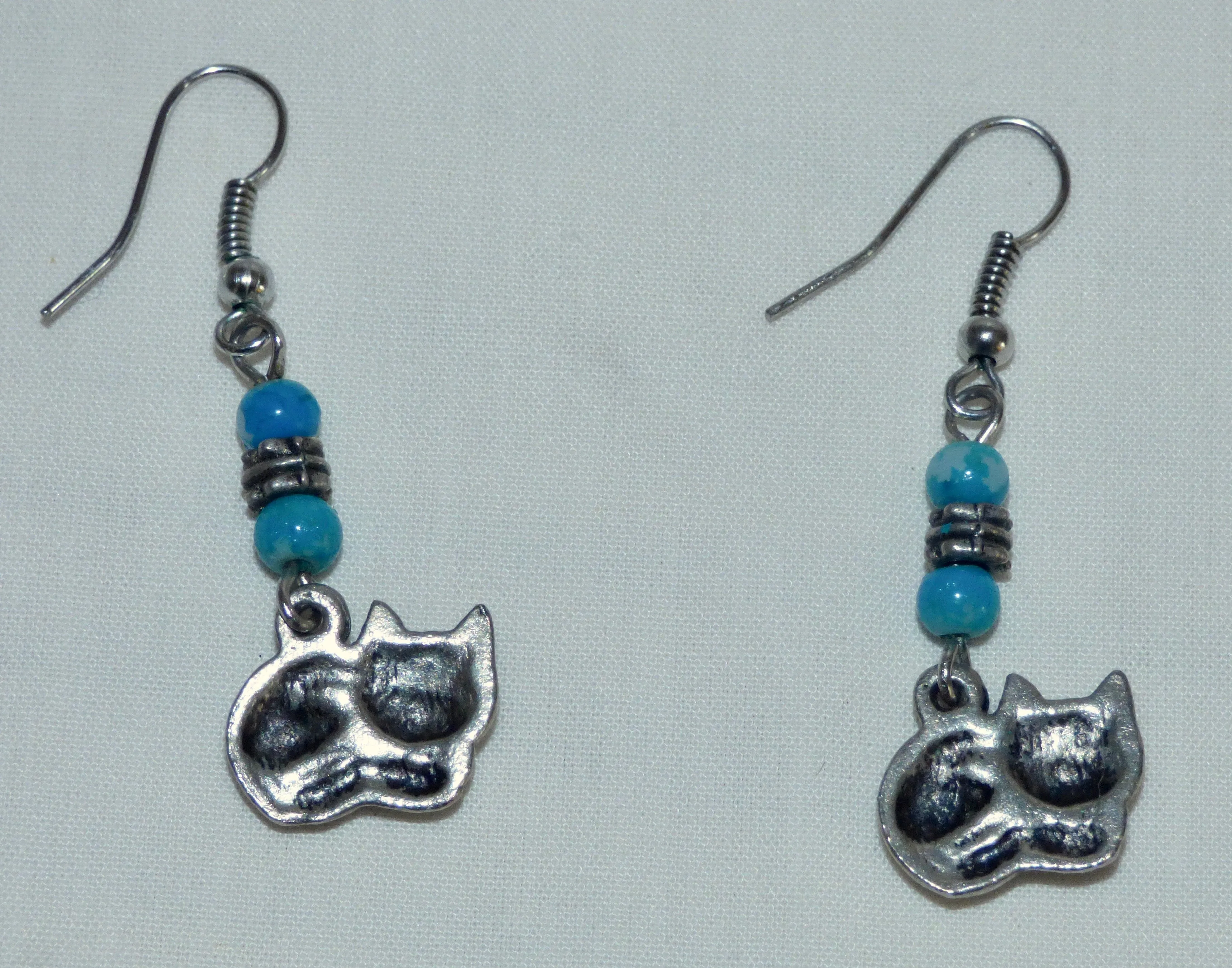 Silver Coloured Metal Cat Dangle And Drop Earrings With Blue Coloured Beads